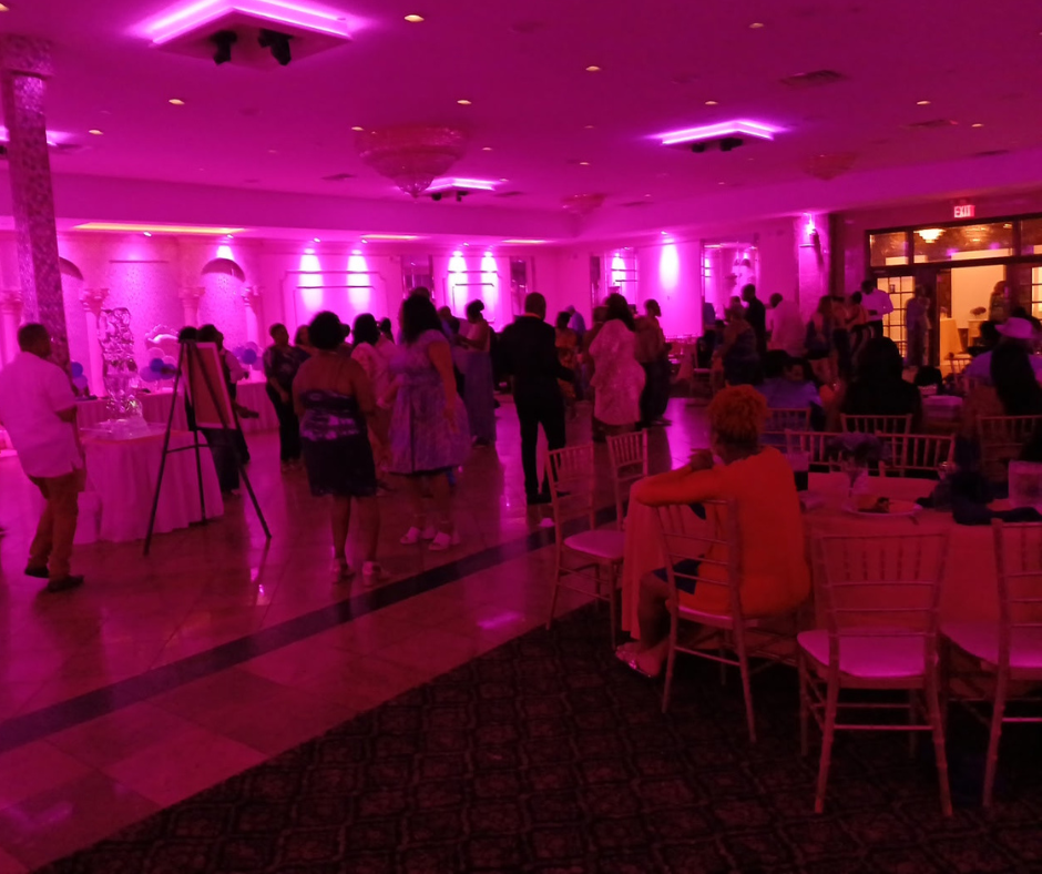 DJ Brown Boy event with vibrant lighting and energetic crowd